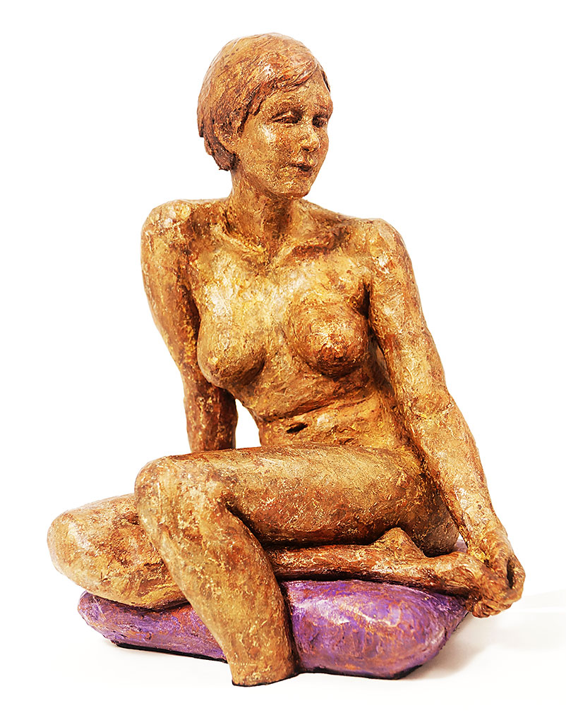 Girl sitting with hand on&nbsp;foot