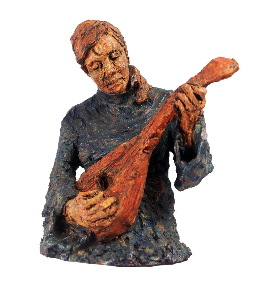 Half figure sculpture of Lucy playing the&nbsp;Mandolin